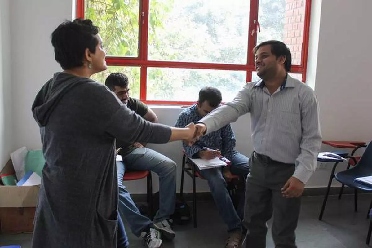 A whole new world: Aditi Muranjan, a teacher at Action for Autism, helps candidates hone their skills at an employment readiness programme
