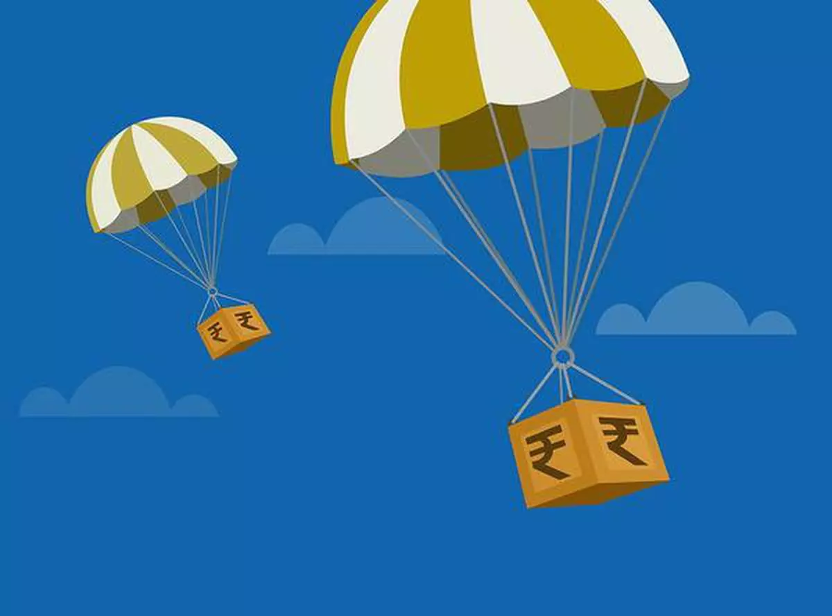 Hot air balloons transporting boxes with Indian Rupee.Concept of Investments in the economy.