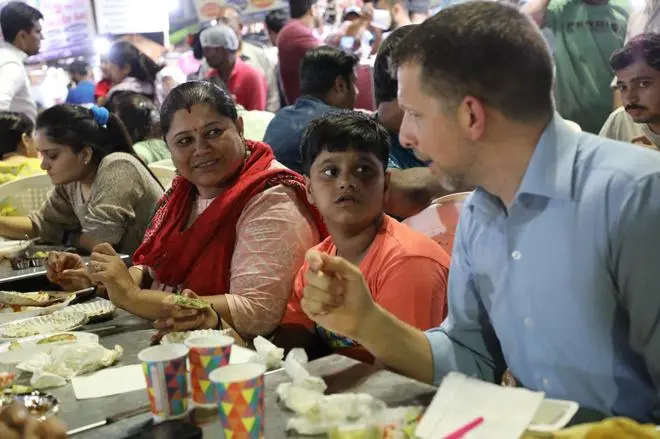 US Consul General Mike Hankey at the US Consulate General- Mumbai tried Gujarati snacks with foodies in Ahmedabad at Manek Chawk. US Consul General Mike Hankey at the US Consulate General- Mumbai tried Gujarati snacks with foodies in Ahmedabad at Manek Chawk.