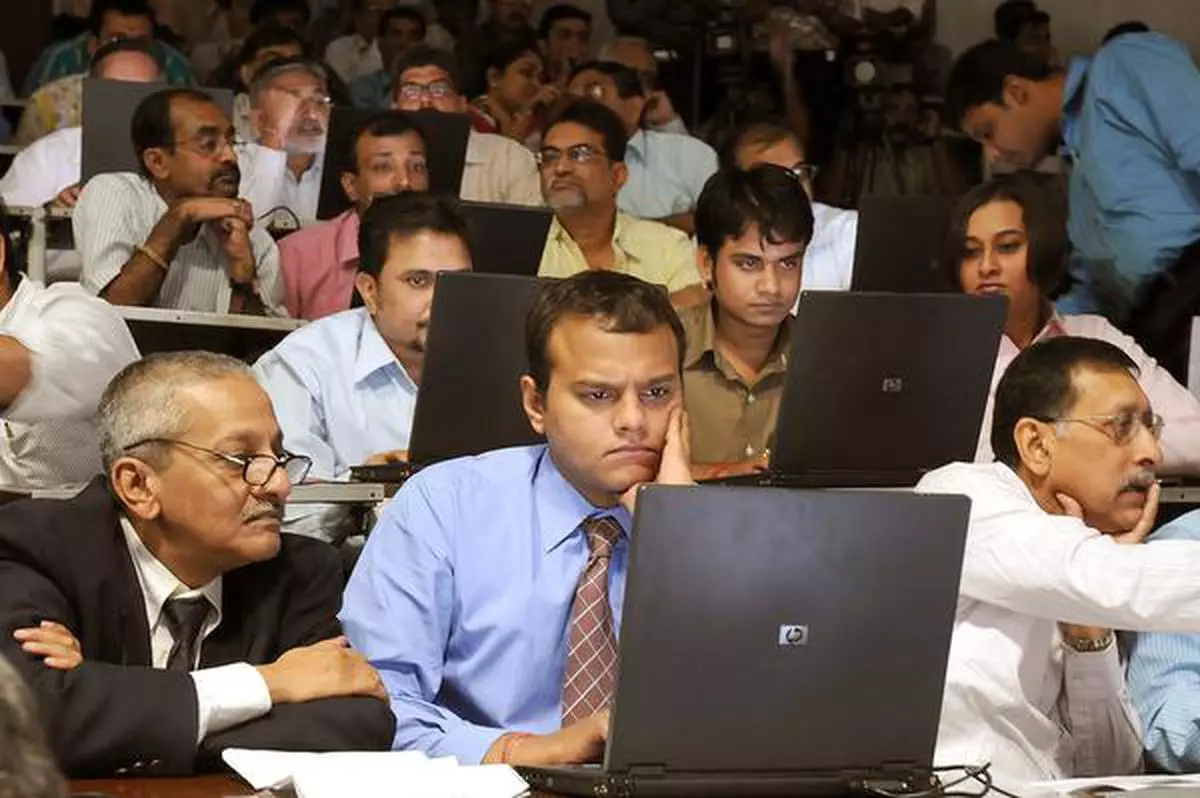 Kolkata: Tea traders are seen busy during  trading through the e-auction system at Kolkata Auction Center on Wednesday.  (file photo).
