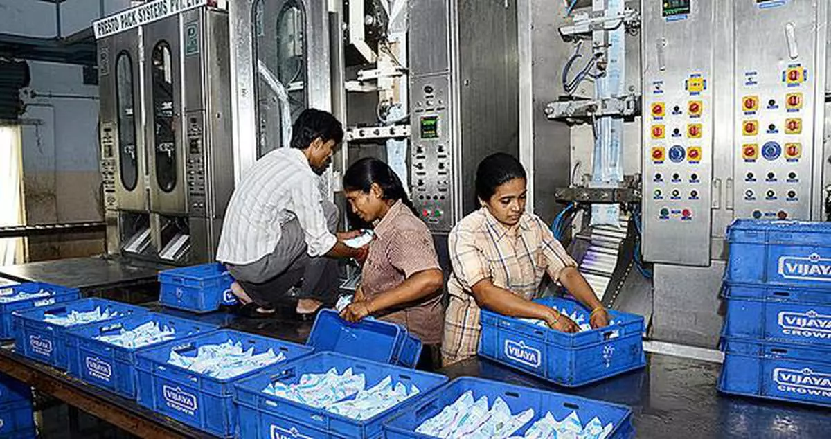 VIJAYAWADA, 30/08/2012: Milk sachets being packed at the milk processing unit of the AP Dairy Development Co-operative Federation - Vijaya, at Kankipadu near Vijayawada. Photo: V. Raju
