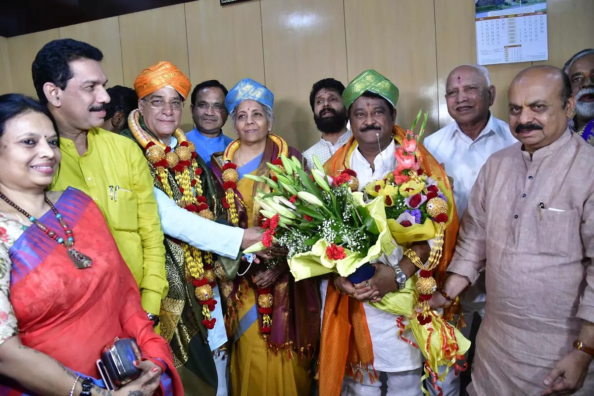 Karnataka CM Basavaraj Bommai greeting newly elected RS members, Lehar Singh Siroya (left), Nirmala Sitharaman and Jaggesh, in Bengaluru on Friday