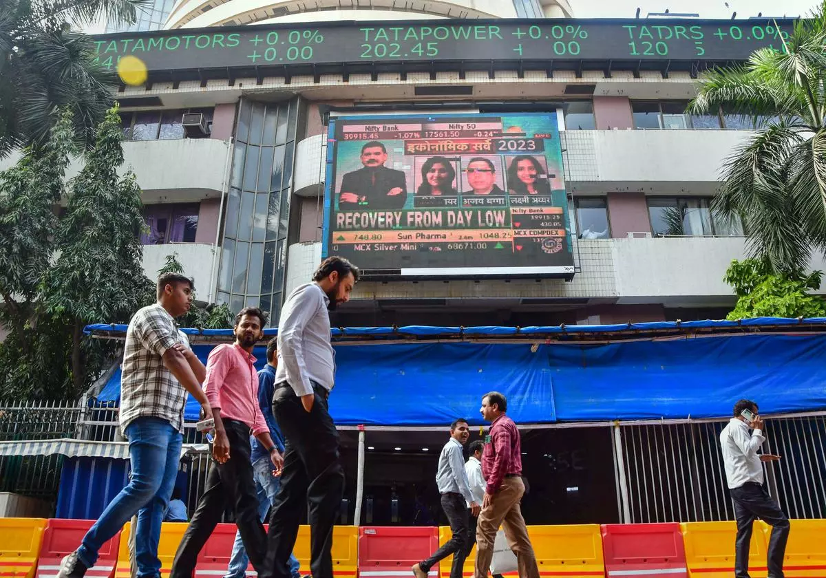 Mumbai: People walk past an electronic signage displayed at the Bombay Stock Exchange (BSE) building, in Mumbai, 