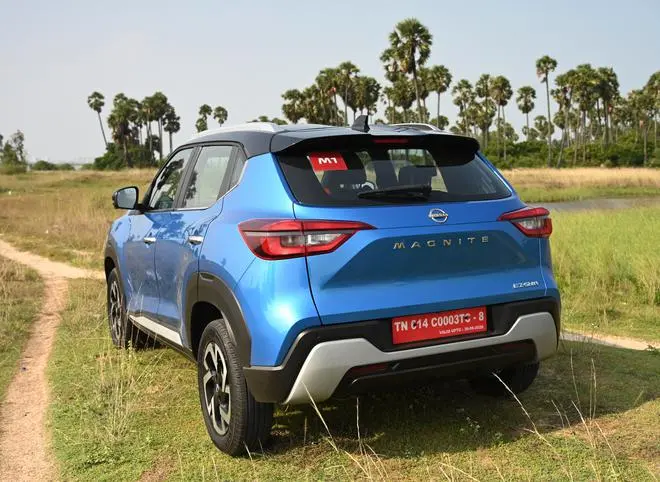 The 3D tail-lamps and the rest of the rear design are identical to the current Magnite and the only addition here is the EZ-Shift badging at the bottom of the tailgate The 3D tail-lamps and the rest of the rear design are identical to the current Magnite and the only addition here is the EZ-Shift badging at the bottom of the tailgate