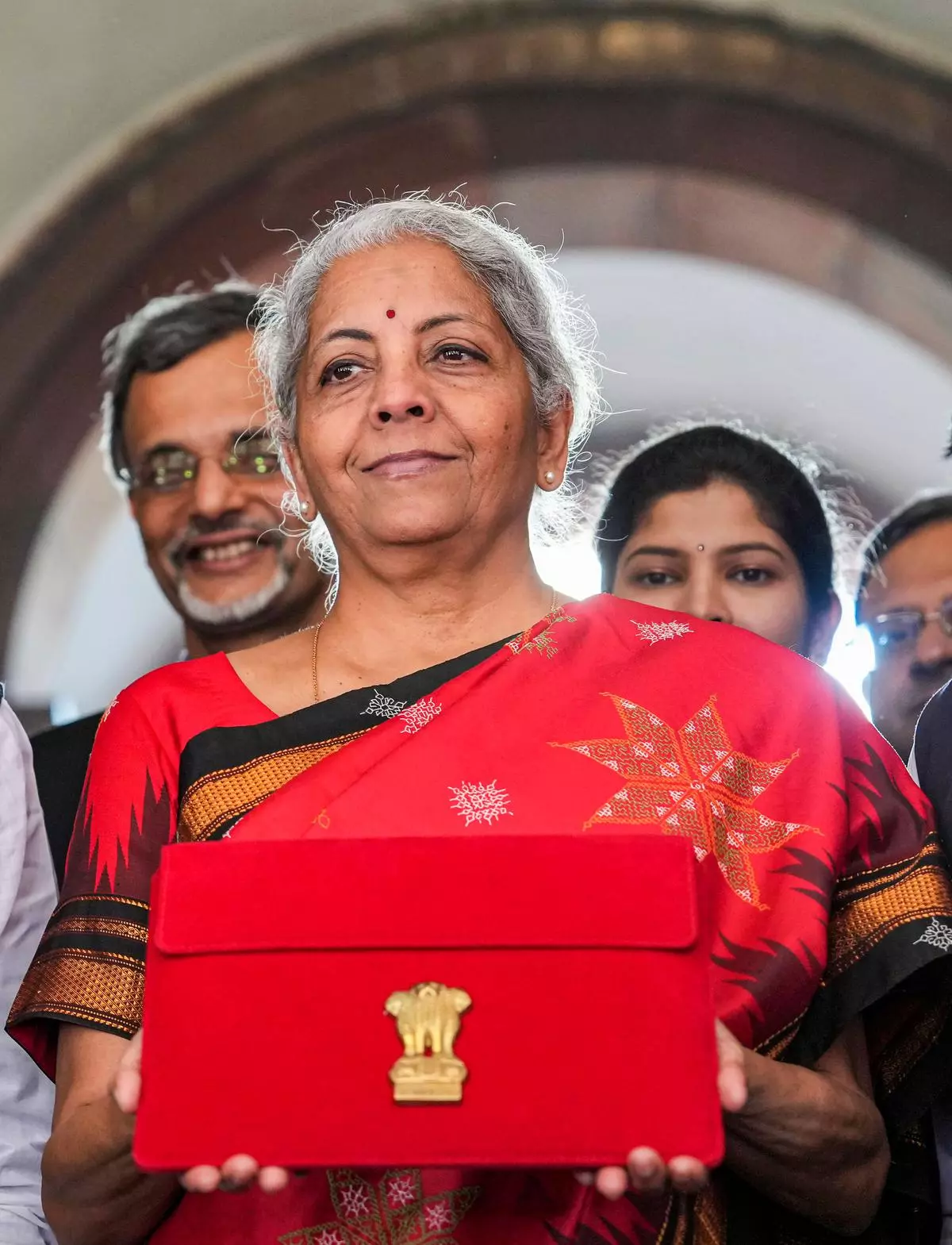 Union Finance Minister Nirmala Sitharaman shows a folder-case containing her Union Budget 2023-24 speech on her arrival at Parliament, in New Delhi, Wednesday, February 1, 2023