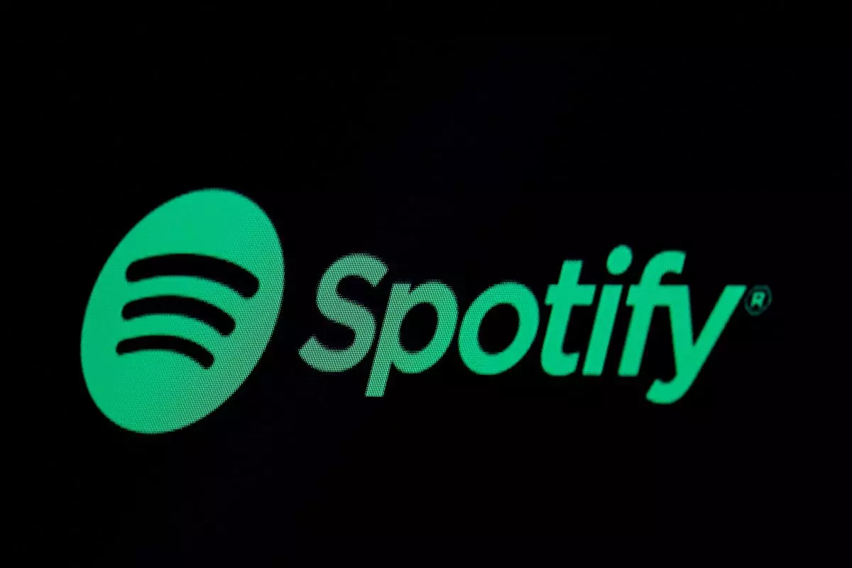 The Spotify logo is displayed on a screen.