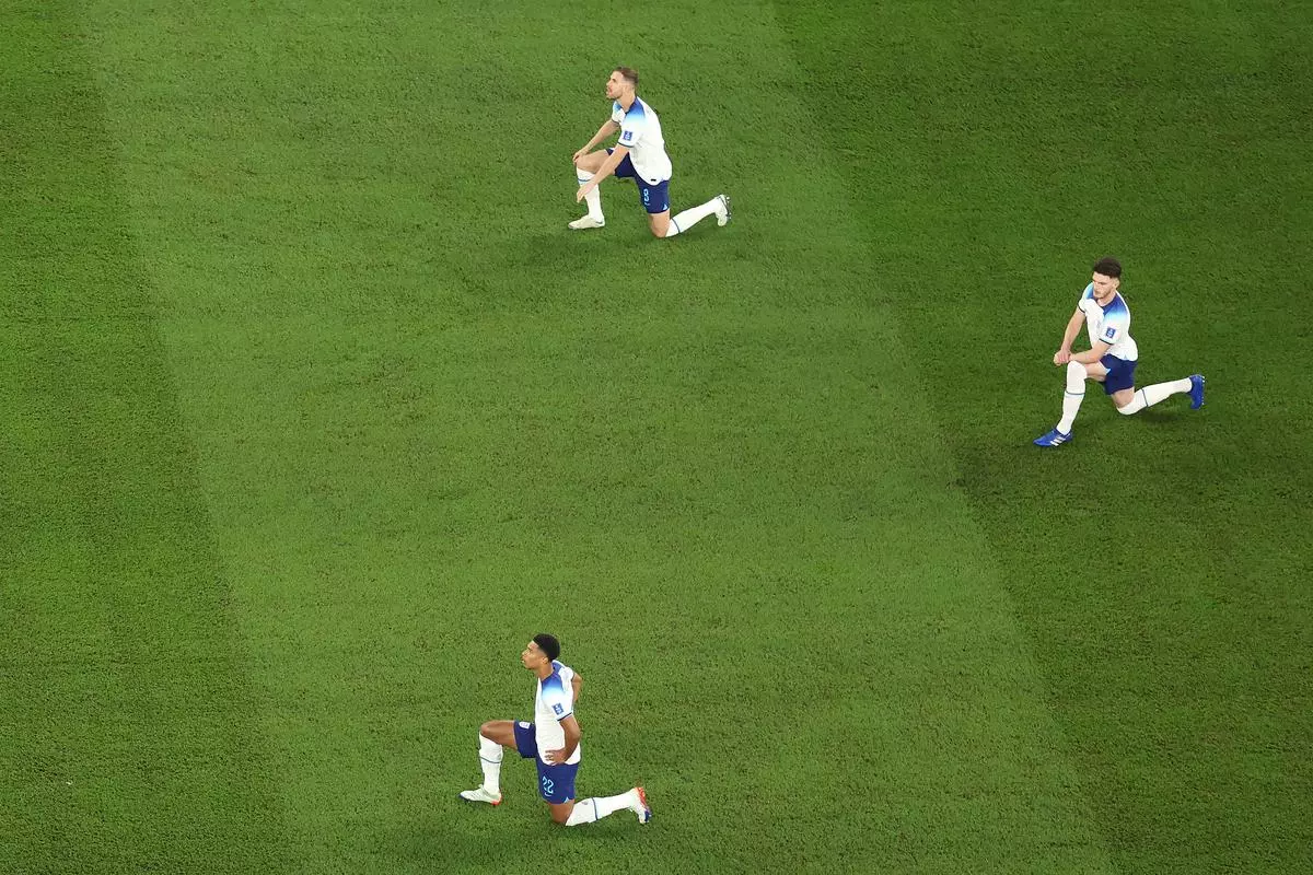 England players kneel prior to a FIFA World Cup  match in support of equality