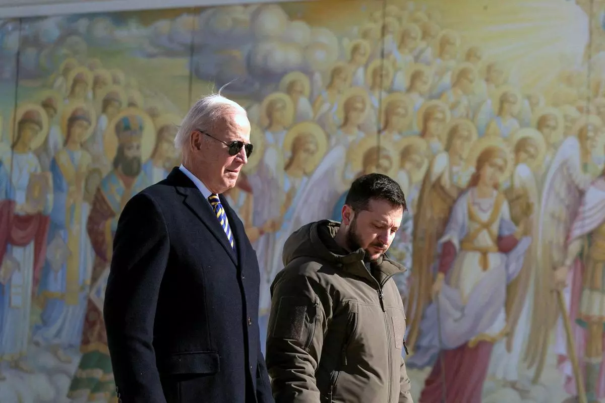 US President Joe Biden walks with Ukrainian President Volodymyr Zelenskiy at St. Michael’s Golden-Domed Cathedral in Kyiv