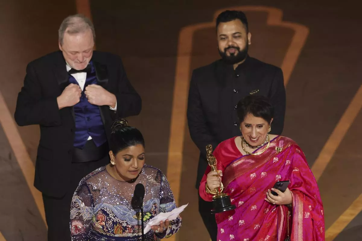 Kartiki Gonsalves and Guneet Monga win the Oscar for Best Documentary Short Subject for “The Elephant Whisperers” during the Oscars show at the 95th Academy Awards in Hollywood.