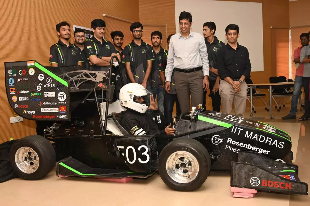 V Kamakoti, Director, IIT Madras with Team Raftar during the unveiling of IIT Madras’s first electric racing car `RFR 23’, in Chennai on Monday 