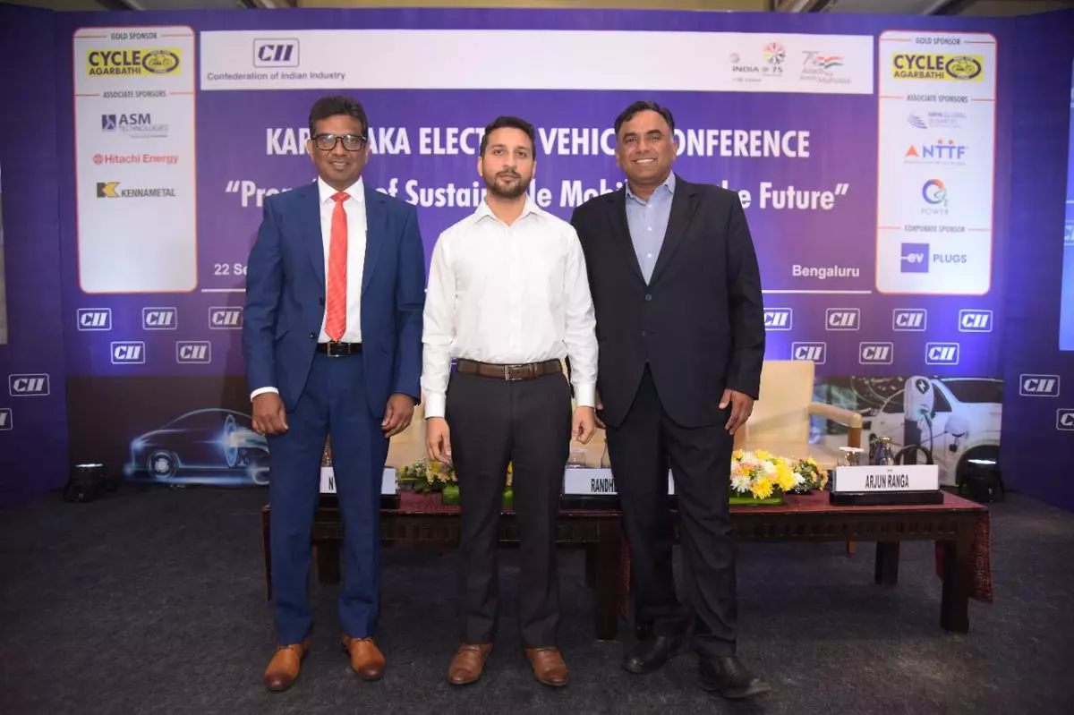 (L-R) N Venu, Convenor of the CII Karnataka Power and Infrastructure Panel and Managing Director and CEO, Hitachi Energy in India and South Asia, Randheer Singh, Director, Electric Mobility and Senior Team Member for Advanced Chemistry Cells Program, NITI Aayog and Arjun M Ranga, Chairman, CII Karnataka, director, NR Group, and managing director, Cycle Pure Agarbathi,