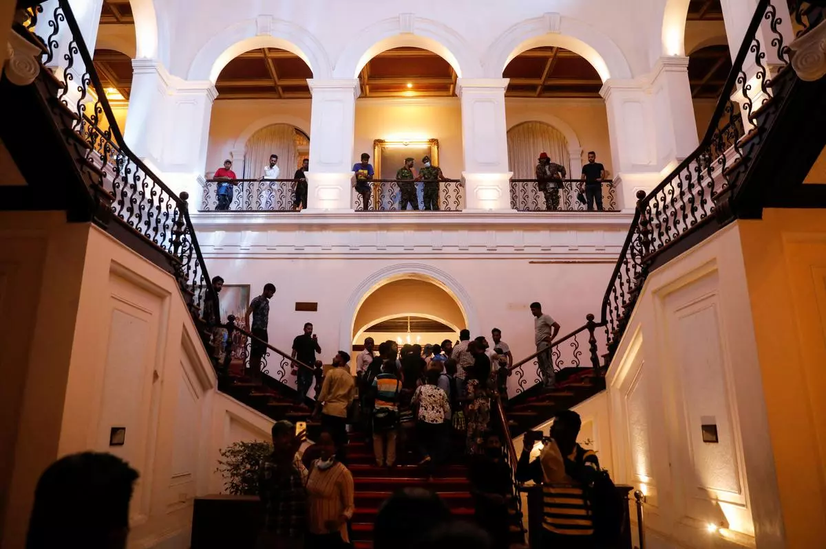 People visit the President’s house after President Gotabaya Rajapaksa fled, amid the country’s economic crisis, in Colombo, Sri Lanka, on Wednesday. 