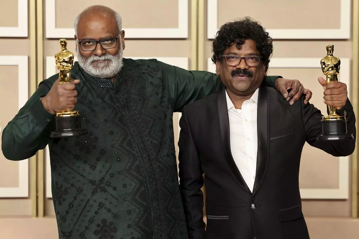 MM Keeravaani and Chandrabose pose with the Oscar for Best Original Song for “Naatu Naatu” from “RRR” in the Oscars photo room at the 95th Academy Awards in Hollywood, Los Angeles, California, the US on March 12, 2023