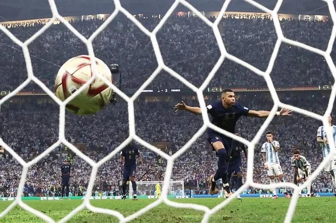 Kylian Mbappe of France completes his hat-trick with his third goal from the penalty spot