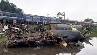 Wreckage of trains near the accident site a day after the collision between the Kanchanjunga Express and a goods train, near Rangapani railway station Wreckage of trains near the accident site a day after the collision between the Kanchanjunga Express and a goods train, near Rangapani railway station