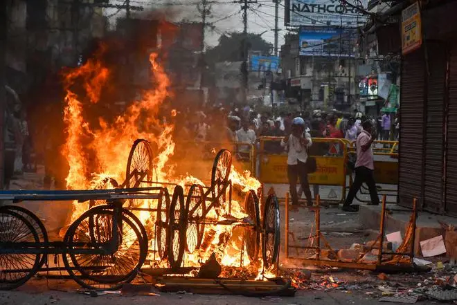 Carts set on fire by miscreants during a protest over controversial remarks made by two now-suspended BJP leaders about Prophet Mohammad, in Ranchi Carts set on fire by miscreants during a protest over controversial remarks made by two now-suspended BJP leaders about Prophet Mohammad, in Ranchi