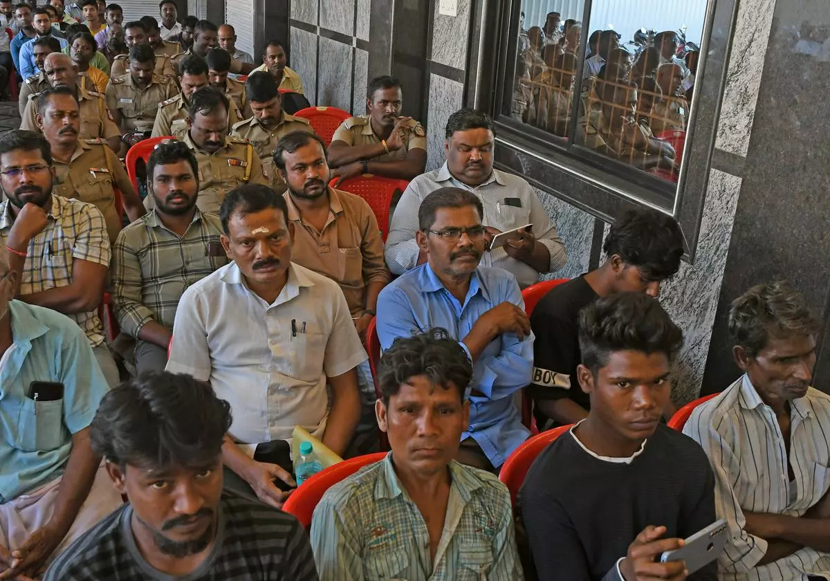 Tamil Nadu Revenue officials and police personnel meeting with migrant workers to dispel misinformation (file photo)