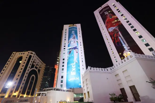 FIFA World Cup Qatar 2022: England’s Harry Kane and Netherlands’ Virgil Van Dijk are pictured on buildings in West Bay ahead of the sporting event