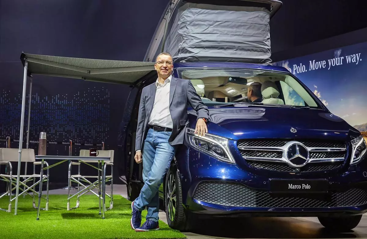 Greater Noida: Martin Schwenk, CEO, Mercedes Benz India poses with the V-Class Marco Polo unveiled in the luxury multi-purpose vehicle segment at the Auto Expo 2020, in Greater Noida, Thursday, Feb. 6, 2020. (PTI Photo/Manish Sharma)(PTI2_6_2020_000093B)