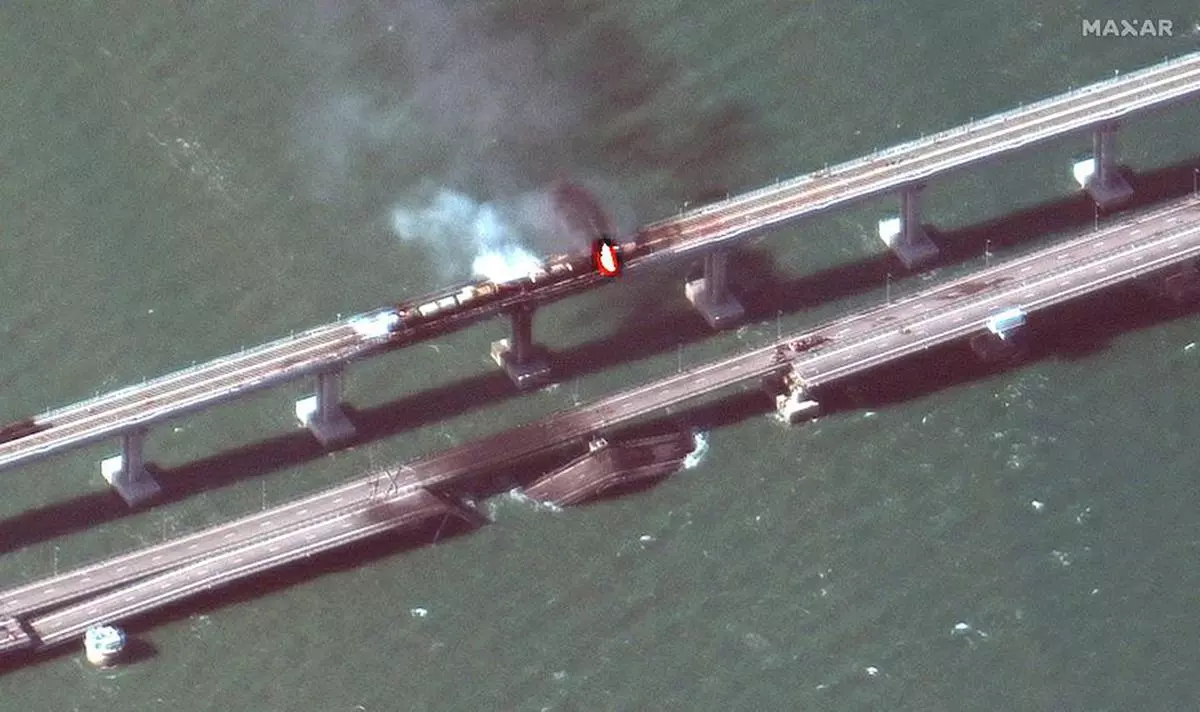 A satellite image shows a close up view of smoke rising from a fire on the Kerch bridge in the Kerch Strait, Crimea, October 8, 2022. 