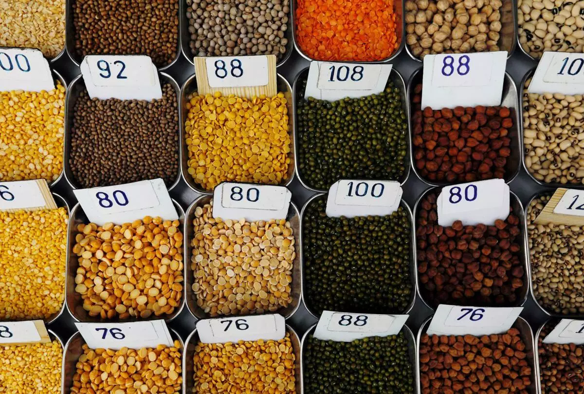 Price tags are seen on the samples of pulses that are kept on display for sale at a market in Mumbai.