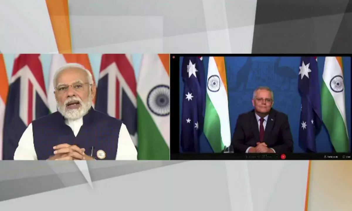 Prime Minister Narendra Modi and his Australian counterpart Scott Morrison during the virtual signing ceremony of India-Australia Economic Cooperation and Trade Agreement
