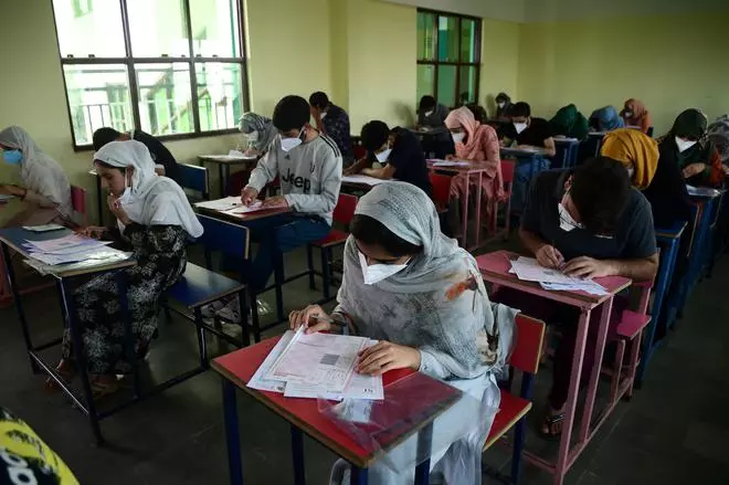 File photo of Candidates appearing for the NEET UG exam, at an examination centre at Spring Buds Higher Secondary School Ompora Budgam district central Kashmir