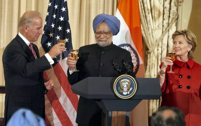 In this file image from November 25, 2009, Prime Minister Manmohan Singh is seen with US Secretary of State Hillary Clinton and Vice President Joe Biden at a toast for ‘Indo-American’ friendship during a luncheon in Washington.