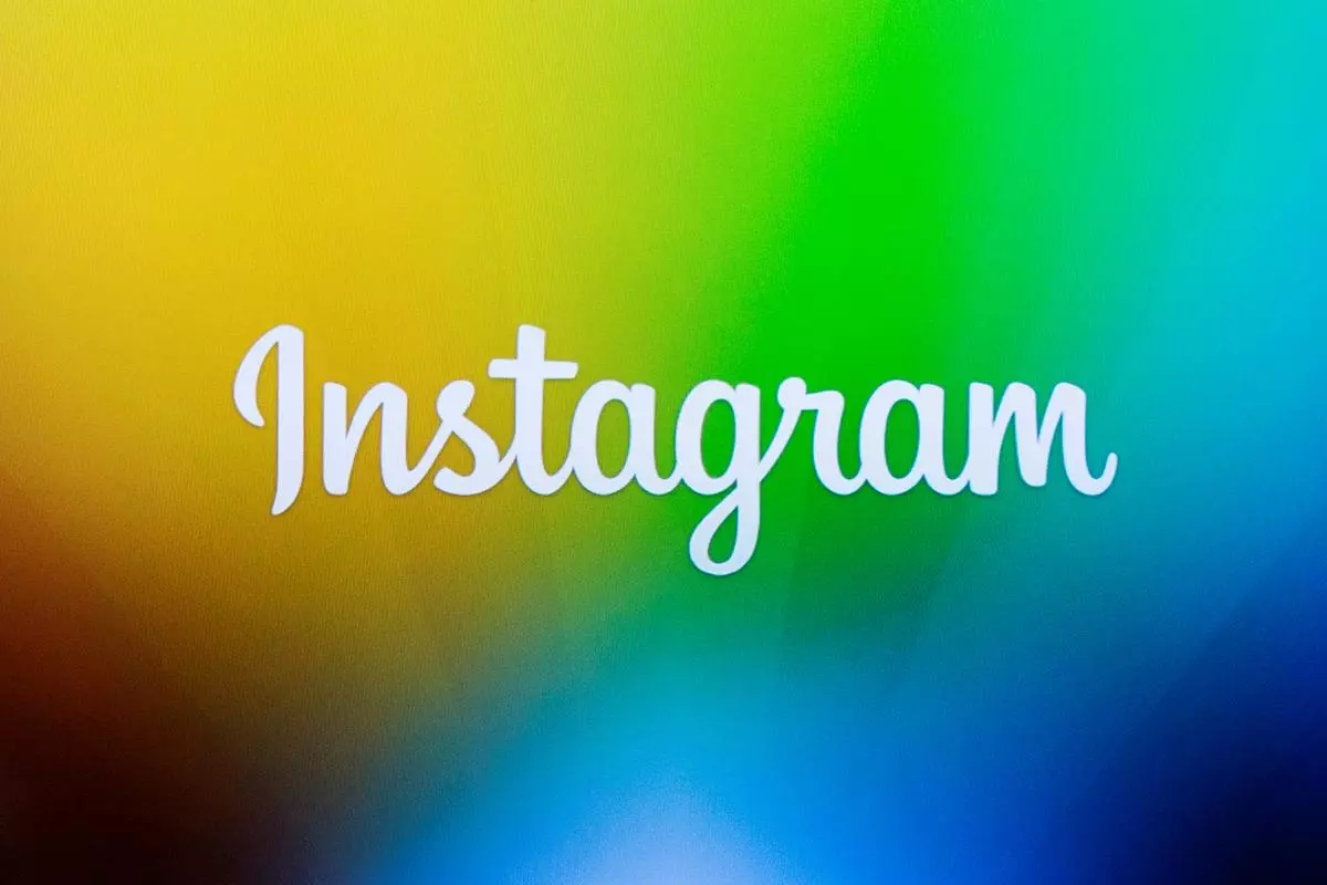 A screen displays the Instagram logo 