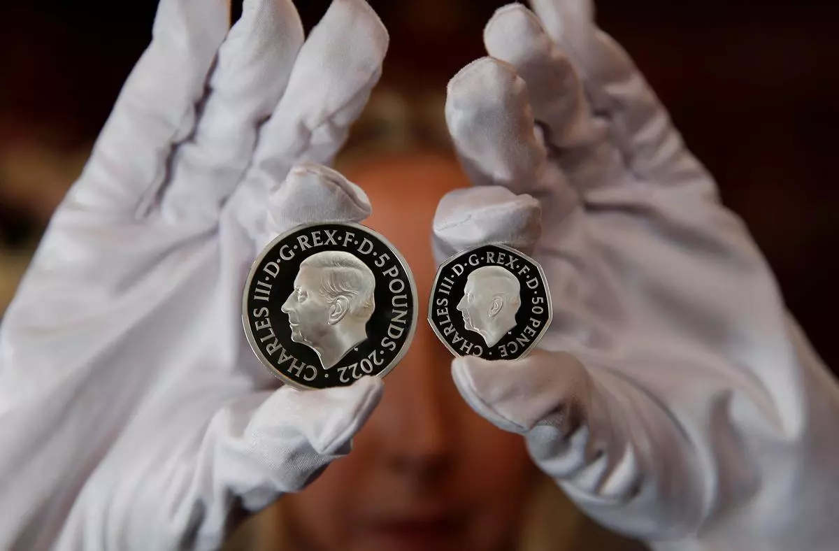 The official coin effigy of Britain’s King Charles III is seen on a £5 crown and 50 pence coin, unveiled by The Royal Mint, in London, Britain, September 29, 2022.  REUTERS/Peter Nicholls