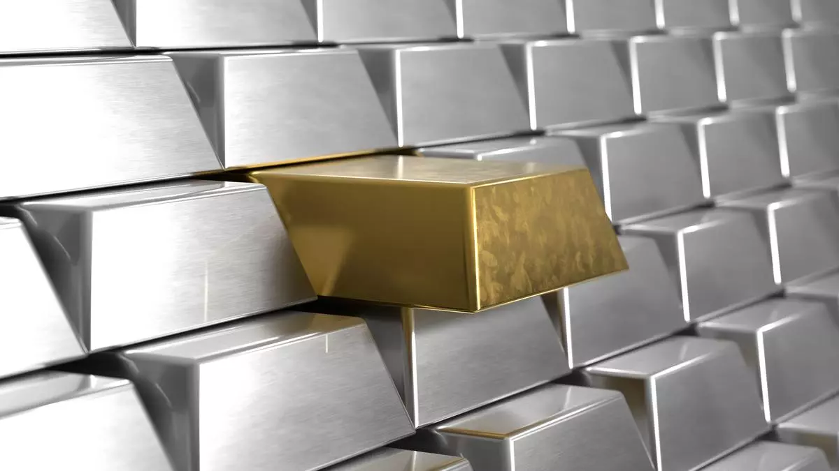 Gold futures fall on low demand, silver futures rise