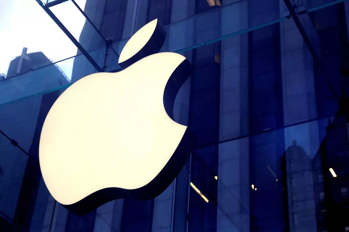 FILE PHOTO: The Apple Inc. logo is seen hanging at the entrance to the Apple store