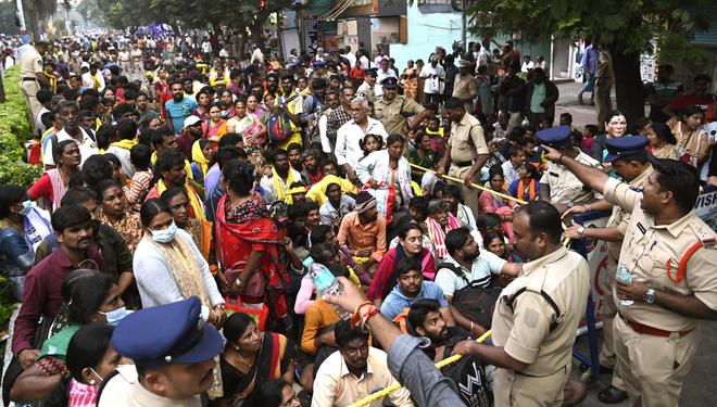 Devotees struggle for space at the token counter, creating a dangerous push-and-jostle situation during the Vaikunta Ekadasi celebrations in Tirupati.