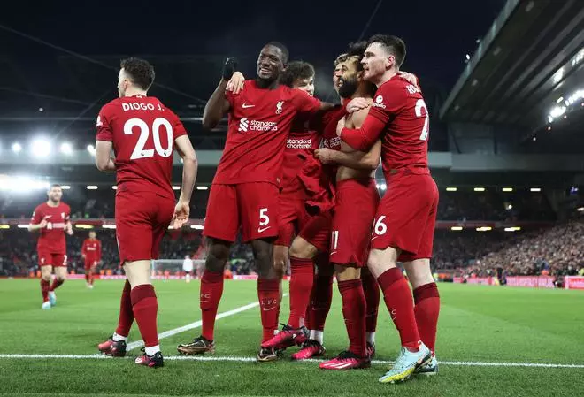 Liverpool’s Mohamed Salah celebrates scoring their sixth goal with teammates.