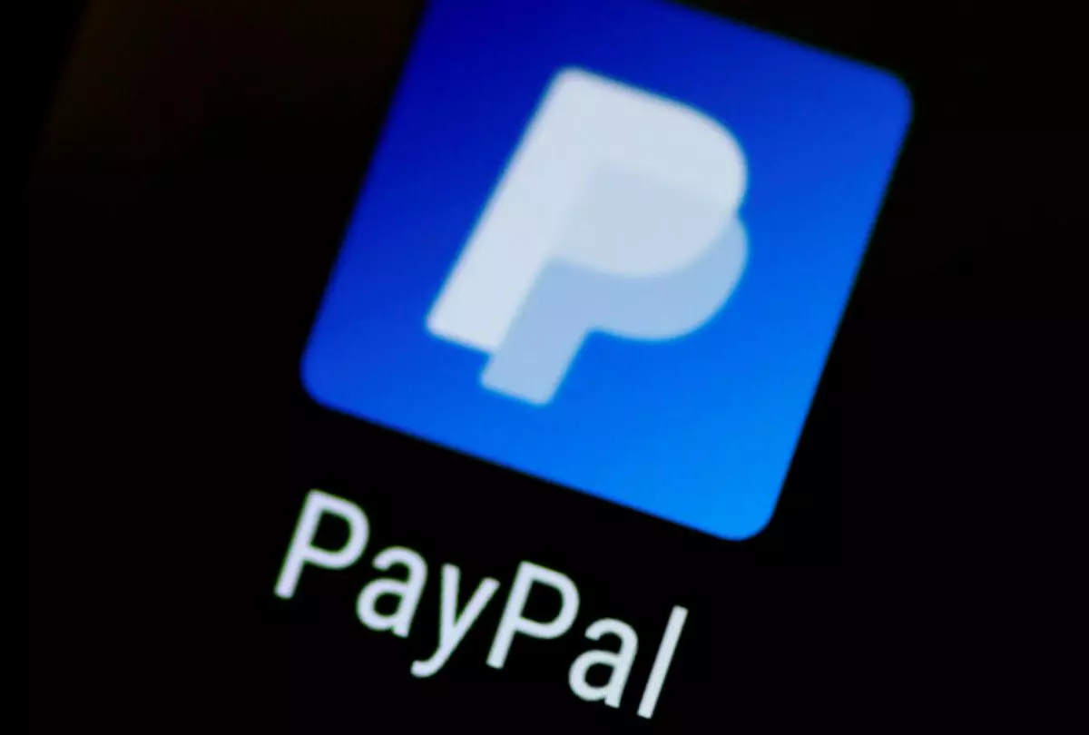 FILE PHOTO: The PayPal app logo is seen on a mobile phone