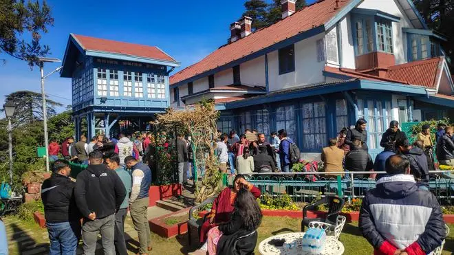 Shimla: Media and Congress party workers outside the residence of party’s Himachal Pradesh in charge Pratibha Singh