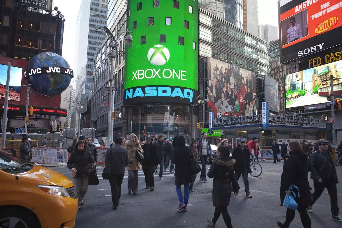 The Xbox One logo is pictured on the NASDAQ building in Times Square in New York, November 21, 2013. REUTERS/Carlo Allegri (UNITED STATES - Tags: BUSINESS LOGO)