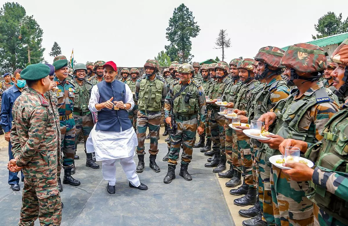 Defence Minister Rajnath Singh interacts with the Armed Forces personnel during his visit to forward areas of Jammu & Kashmir