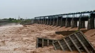 Damaged cemented blocks lie in the water beside an under-construction dam on the Tawi River, following heavy rainfall in Jammu, Indian Kashmir, August 27, 2025. REUTERS/Mukesh Gupta