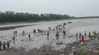 Akhnoor: People are seen walking across the midstream of the Chenab River due to a significant reduction in water flow, following the suspension of the Indus Waters Treaty, in Akhnoor Akhnoor: People are seen walking across the midstream of the Chenab River due to a significant reduction in water flow, following the suspension of the Indus Waters Treaty, in Akhnoor