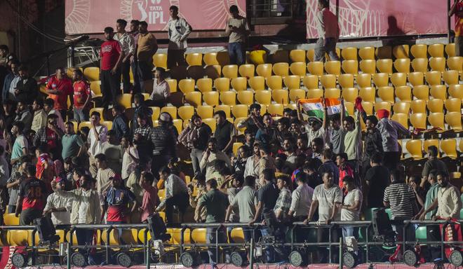 Spectators leave after the Indian Premier League (IPL) 2025 T20 cricket match between Punjab Kings and Delhi Capitals was suspended, at the HPCA Stadium, in Dharamsala, on Thursday Spectators leave after the Indian Premier League (IPL) 2025 T20 cricket match between Punjab Kings and Delhi Capitals was suspended, at the HPCA Stadium, in Dharamsala, on Thursday