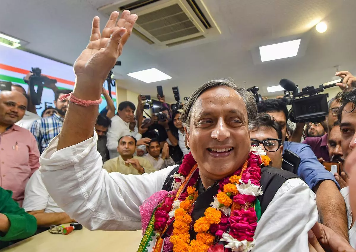 Senior Congress leader Shashi Tharoor reacts after filing his nomination papers for the post of party president, at AICC headquarters in New Delhi, on Friday
