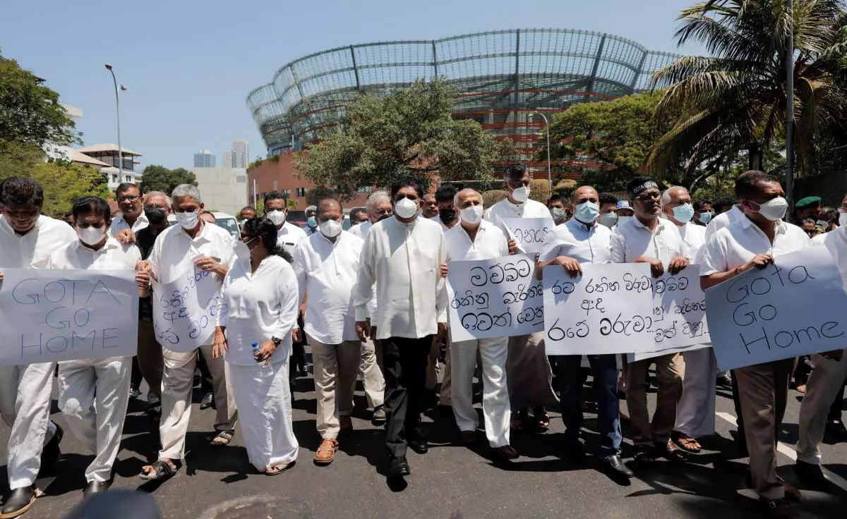 Sajith Premadasa, leader of the opposition alliance, Samagi Jana Balawegaya, marches along with other opposition lawmakers towards Independence Square as they shout slogans against President Gotabaya Rajapaksa in Colombo, Sri Lanka, April 3, 2022