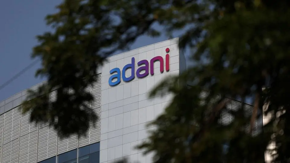 FILE PHOTO: The logo of the Adani Group is seen on the facade of its Corporate House on the outskirts of Ahmedabad, India, November 21, 2024. REUTERS/Amit Dave/File Photo