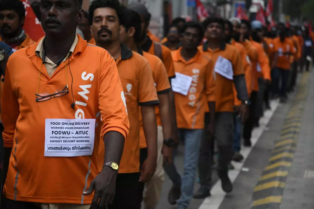 Online food delivery workers have organised a protest march to the office of the food delivery company Swiggy on Thursday as an indefinite strike by around 4,000 workers in Ernakulam district continued. Photo : Thulasi Kakkat/The Hindu