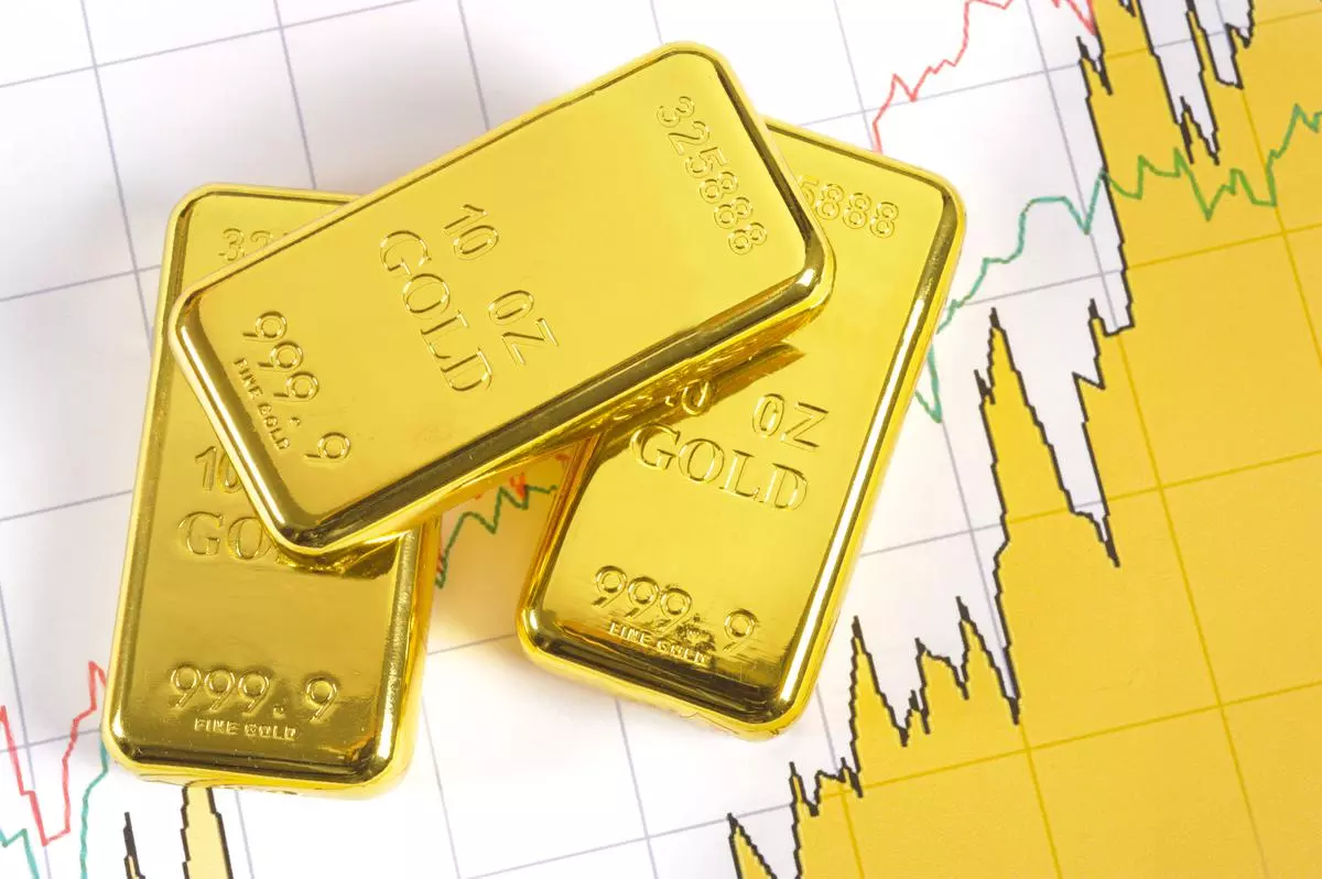 three gold bars on stock market chart istock photo for BL