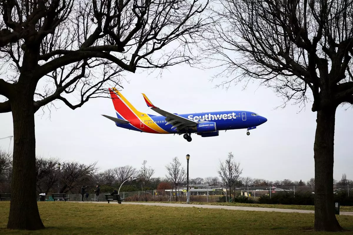 A Southwest Airlines jet comes in for a landing after flights earlier were grounded during an FAA system outage at Laguardia Airport in New York
