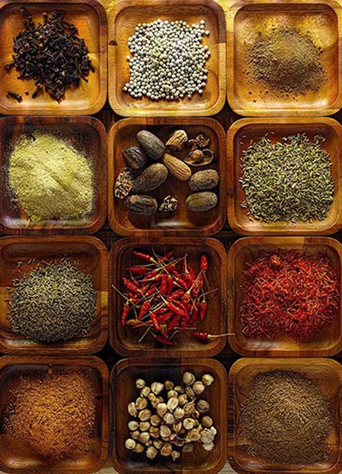 File Photo: Indian cooking spices in wooden trays.