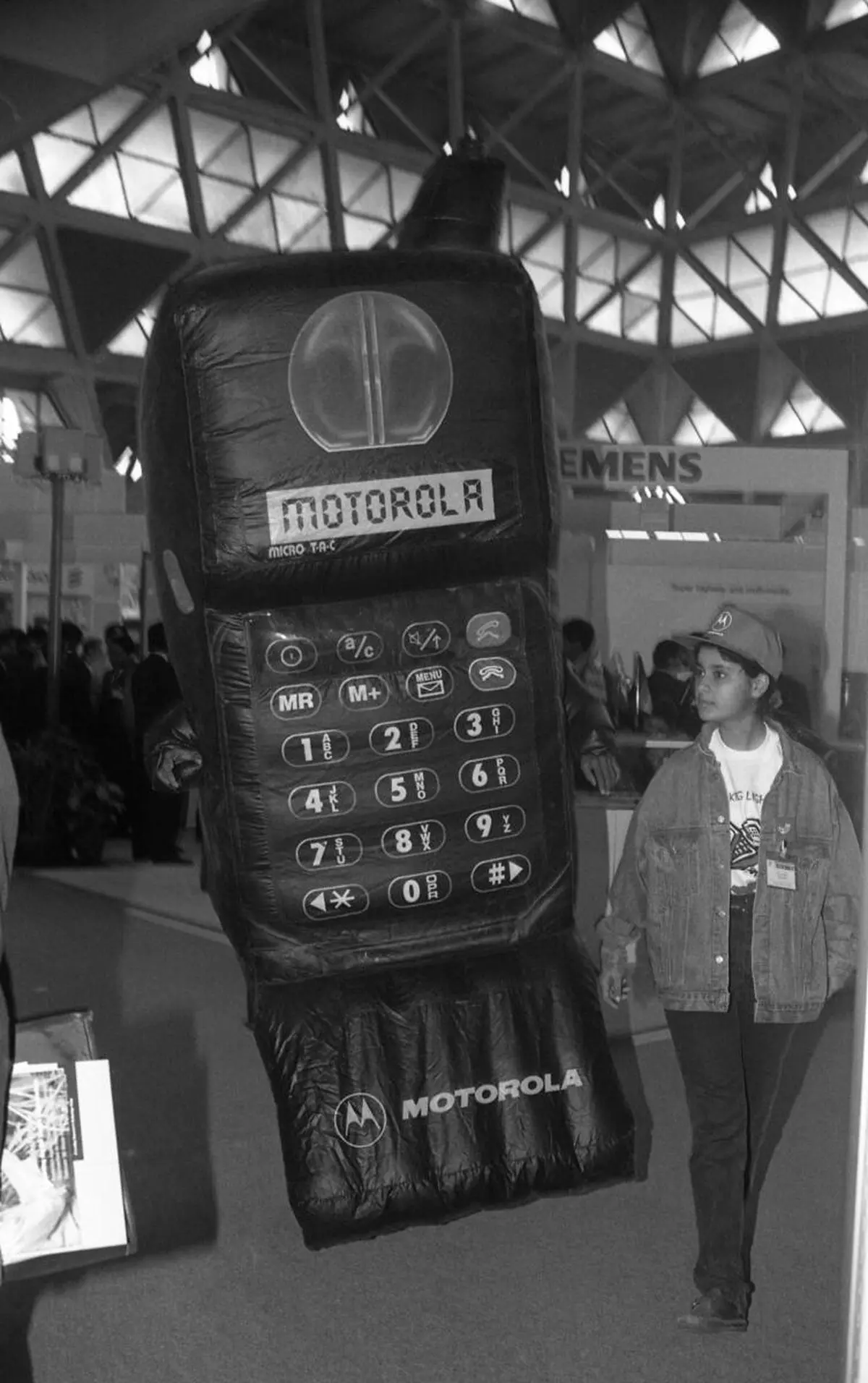 A giant inflatable mobile phone model (motorola) on display at the Communications India 1995 Exhibition at Pragati Maidan in New Delhi on December 07, 1995. 
