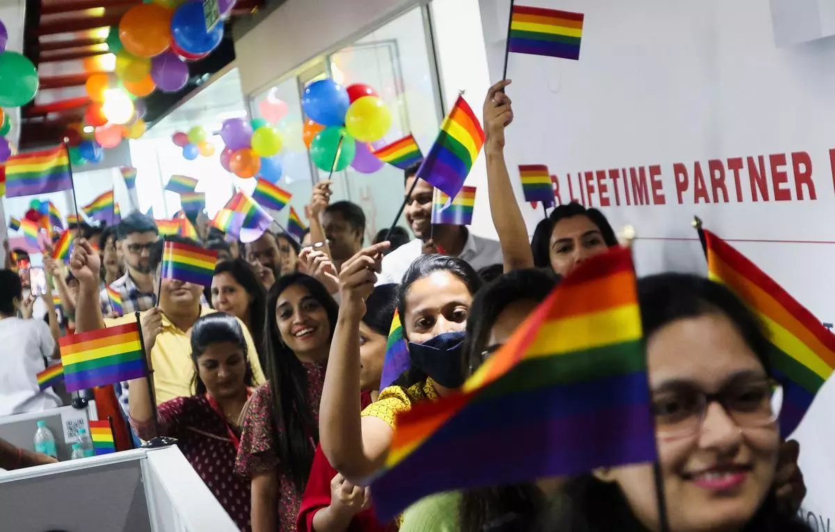 People waving rainbow flags during an event in support of the LGBTQ+ community during Pride month in Mumbai (file photo)